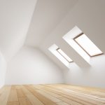 White attic with light wood floor