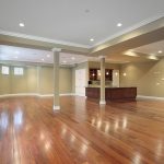 large empty basement with wood floor