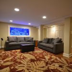 Basement with fish tank and sofas