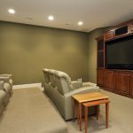Basement with leather sofas and television