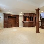 Basement with dark wood cabinets