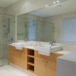 Bathroom with two sinks and large mirror
