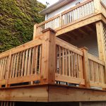 Porch with wooden rails and balcony