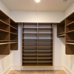 Large closet with brown shelving