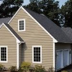 Light brown siding and two door garage